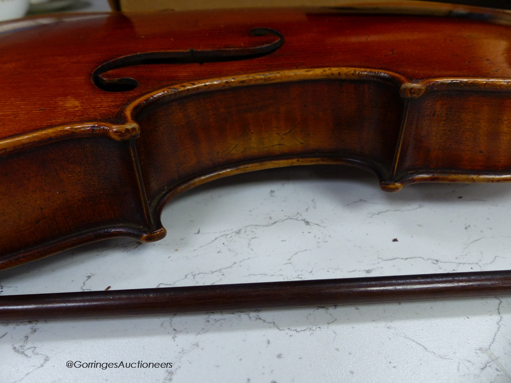 A Lowendall violin, labelled Stradivarius, 58cm long, together with a bow